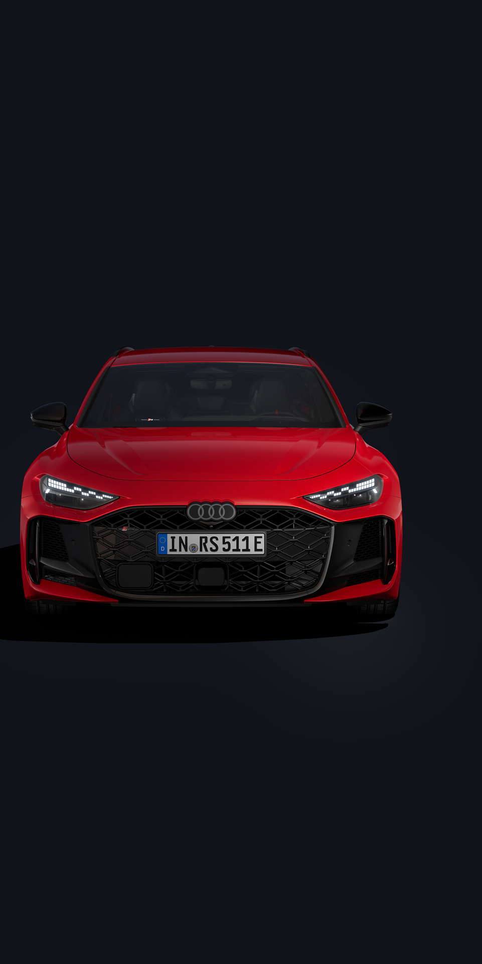 Ein roter Audi RS 5 Avant ist auf schwarzem Hintergrund abgebildet.